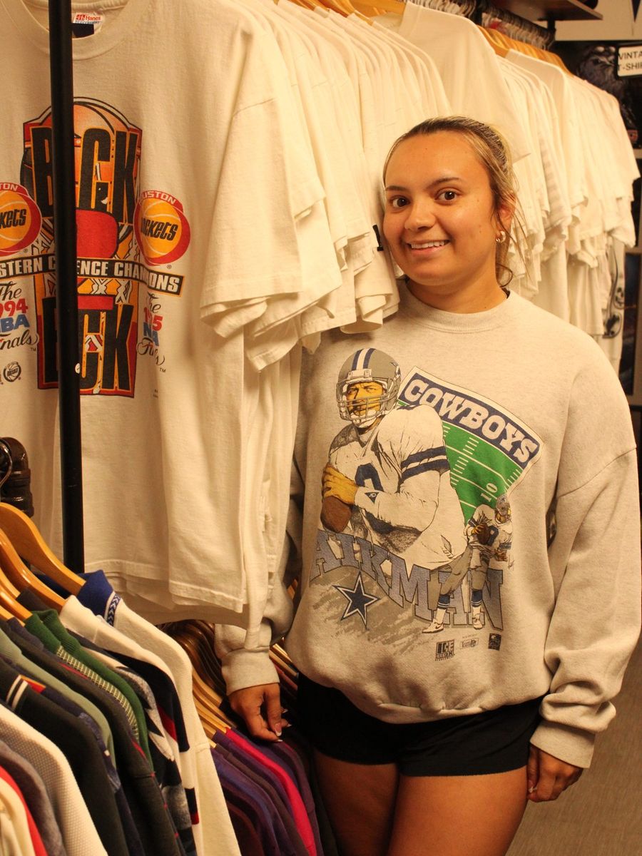 Shopper wearing a vintage Troy Aikman Dallas Cowboys crewneck